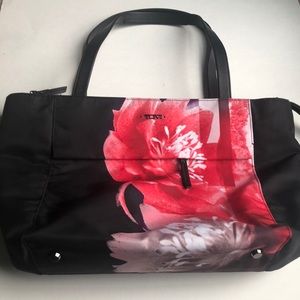 Tumi Red and Black Carry on Bag Floral Design and trolly sleeve